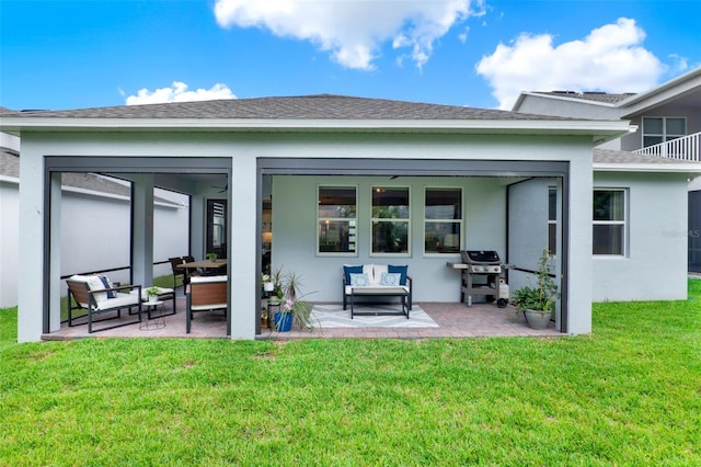 1219 Foltz Loop, Oakland, FL 34787 - back of property featuring a patio area, stucco siding, and a lawn