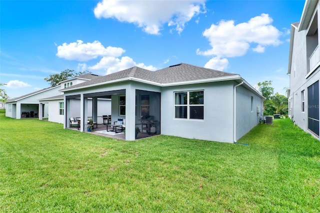 1219 Foltz Loop, Oakland, FL 34787 - rear view of house with a patio area, a yard, roof with shingles, and stucco siding