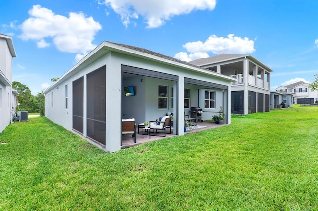 1219 Foltz Loop, Oakland, FL 34787 - rear view of house with a yard, a patio, stucco siding, and an outdoor living space