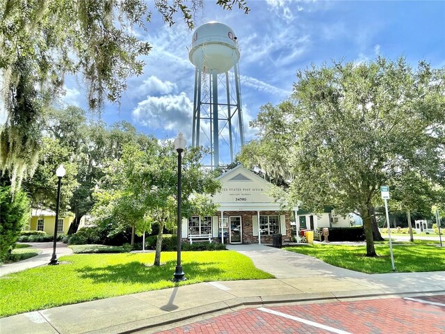1219 Foltz Loop, Oakland, FL 34787 - view of property's community featuring a lawn
