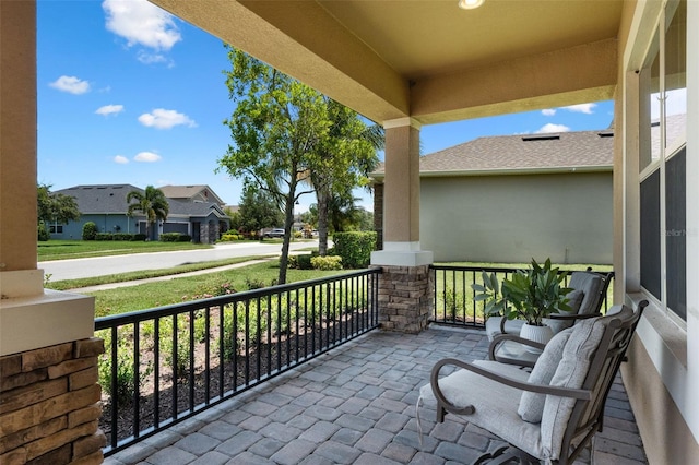 13851 Jomatt Loop, Winter Garden, FL 34787 - covered porch featuring a residential view