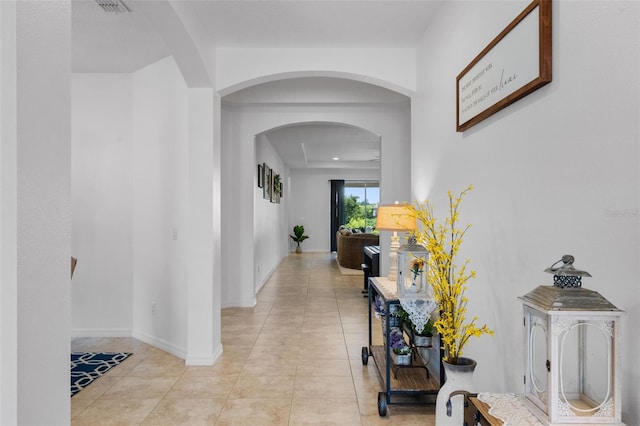 13851 Jomatt Loop, Winter Garden, FL 34787 - hall with arched walkways and light tile patterned floors