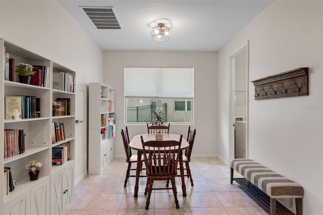 13851 Jomatt Loop, Winter Garden, FL 34787 - dining room featuring a textured ceiling and light tile patterned flooring