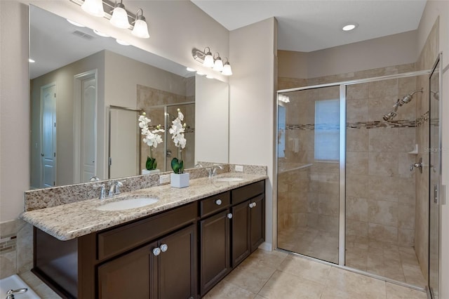 13851 Jomatt Loop, Winter Garden, FL 34787 - bathroom featuring double vanity, a stall shower, and tile patterned flooring