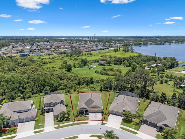 13851 Jomatt Loop, Winter Garden, FL 34787 - aerial perspective of suburban area featuring property boundaries highlighted and a large body of water