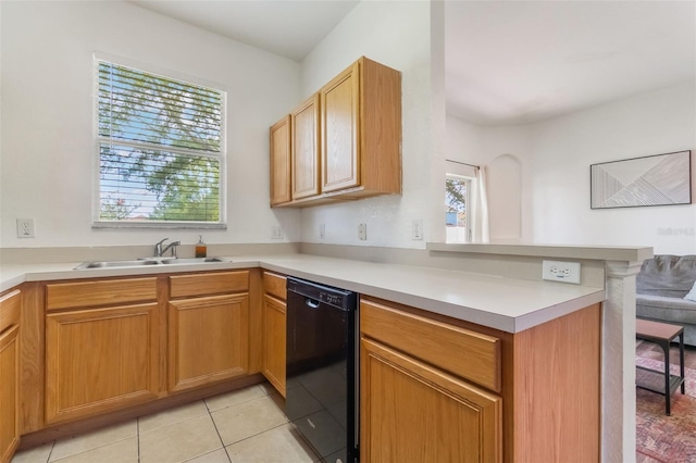 4224 Calabria Ave, Davenport, FL 33897 - kitchen with black dishwasher, a peninsula, a kitchen bar, light countertops, and light tile patterned floors