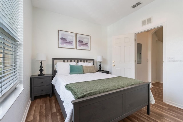 4224 Calabria Ave, Davenport, FL 33897 - bedroom featuring dark wood-style floors, electric panel, and arched walkways