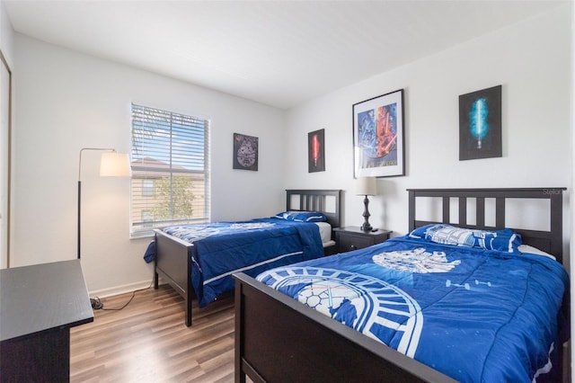 4224 Calabria Ave, Davenport, FL 33897 - bedroom with wood finished floors and baseboards