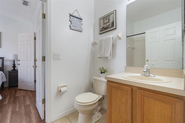 4224 Calabria Ave, Davenport, FL 33897 - full bathroom featuring vanity, a shower, and wood finished floors