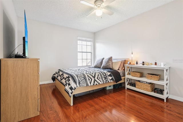 364 Northpointe Ct Unit 208, Altamonte Springs, FL 32701 - bedroom featuring wood finished floors, a textured ceiling, and a ceiling fan