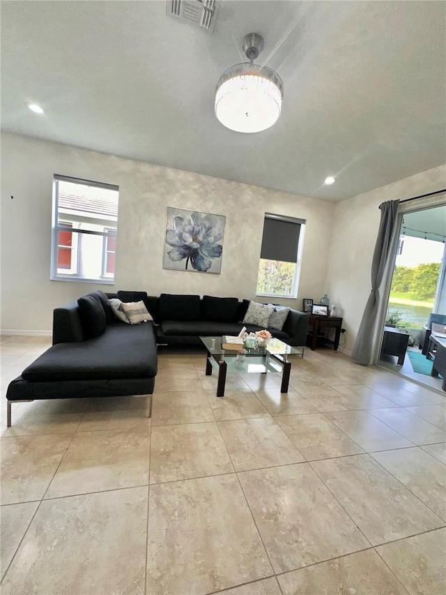 10110 SW Chadwick Dr, Port St Lucie, FL 34987 - living area featuring plenty of natural light, light tile patterned floors, and recessed lighting