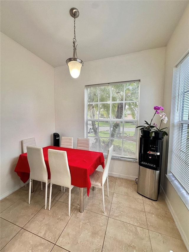 10110 SW Chadwick Dr, Port St Lucie, FL 34987 - dining area with baseboards and light tile patterned floors