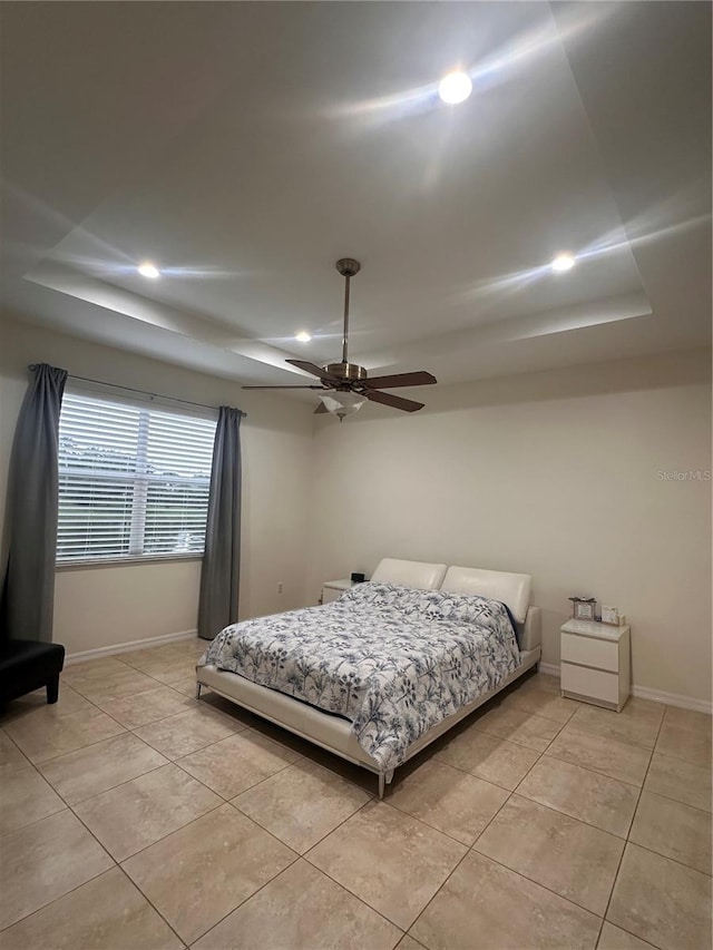 10110 SW Chadwick Dr, Port St Lucie, FL 34987 - bedroom featuring recessed lighting, light tile patterned floors, a tray ceiling, and ceiling fan