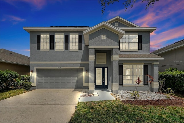 9049 Edenshire Cir, Orlando, FL 32836 - traditional home with stucco siding, an attached garage, and driveway