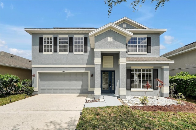 9049 Edenshire Cir, Orlando, FL 32836 - view of front of house featuring a garage, concrete driveway, and stucco siding