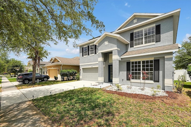 9049 Edenshire Cir, Orlando, FL 32836 - view of front of house featuring stucco siding, concrete driveway, a garage, and a front yard