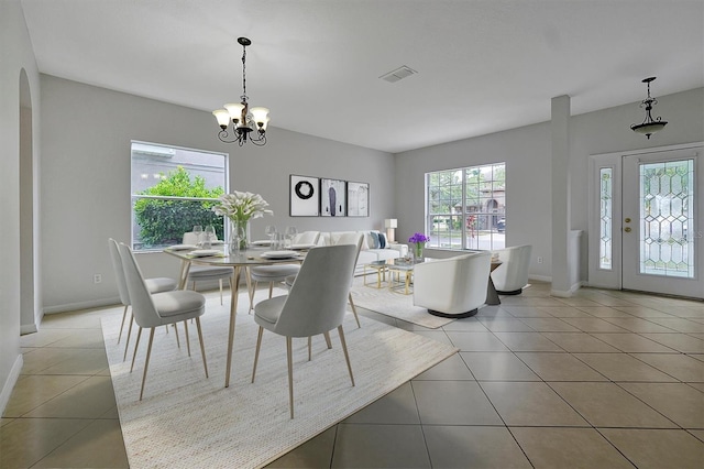 9049 Edenshire Cir, Orlando, FL 32836 - dining area featuring light tile patterned flooring and a chandelier