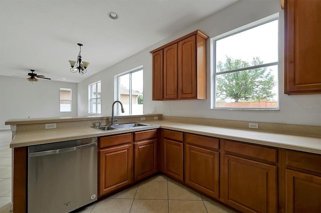 9049 Edenshire Cir, Orlando, FL 32836 - kitchen featuring dishwasher, brown cabinetry, a peninsula, light tile patterned floors, and recessed lighting