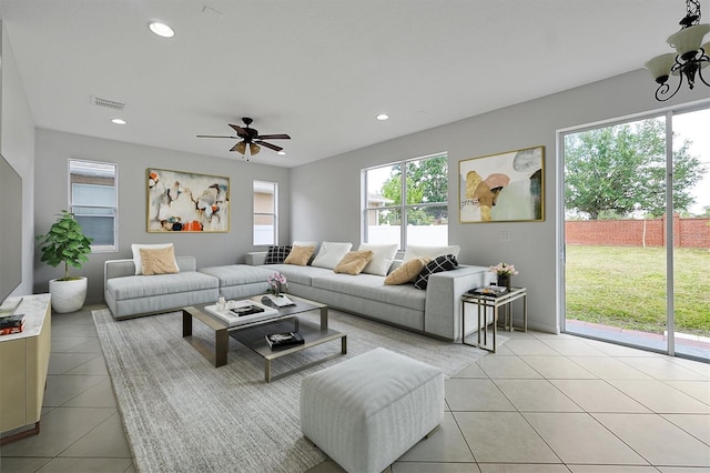 9049 Edenshire Cir, Orlando, FL 32836 - living area featuring light tile patterned floors, plenty of natural light, and recessed lighting