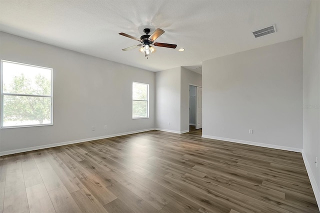 9049 Edenshire Cir, Orlando, FL 32836 - empty room featuring ceiling fan, dark wood finished floors, and recessed lighting