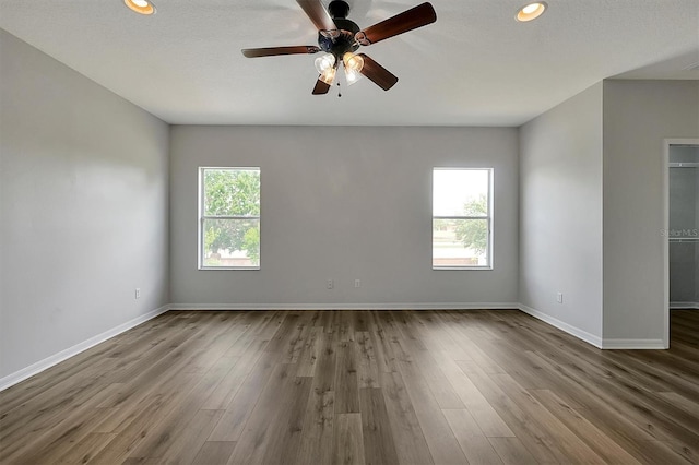 9049 Edenshire Cir, Orlando, FL 32836 - spare room with a ceiling fan, recessed lighting, and dark wood-type flooring