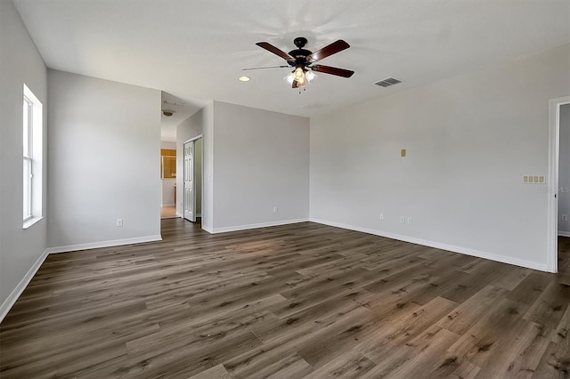 9049 Edenshire Cir, Orlando, FL 32836 - empty room featuring ceiling fan, dark wood-style floors, and recessed lighting