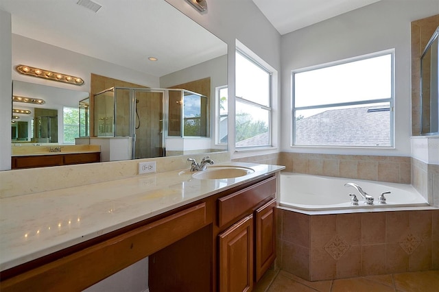 9049 Edenshire Cir, Orlando, FL 32836 - full bathroom with a bath, a shower stall, vanity, and tile patterned floors