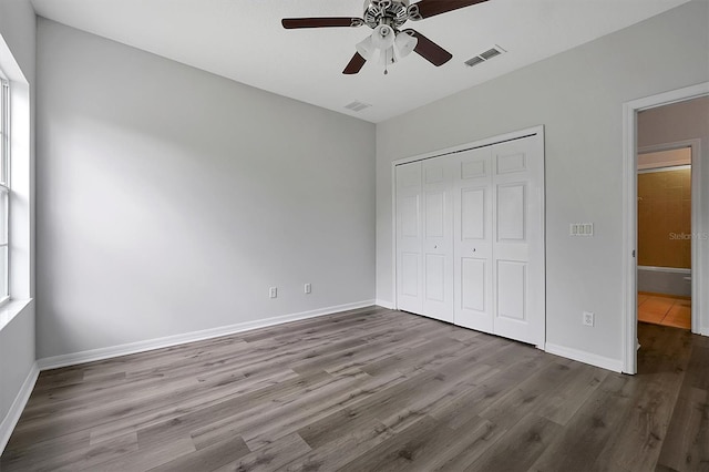 9049 Edenshire Cir, Orlando, FL 32836 - unfurnished bedroom with wood finished floors, a closet, and ceiling fan