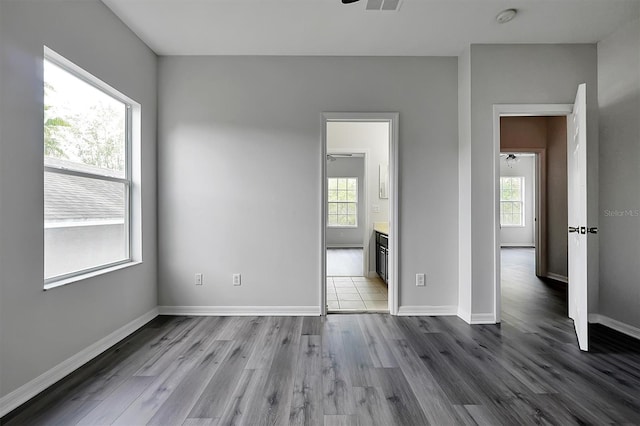 9049 Edenshire Cir, Orlando, FL 32836 - spare room with healthy amount of natural light, dark wood-type flooring, ceiling fan, and a smoke detector