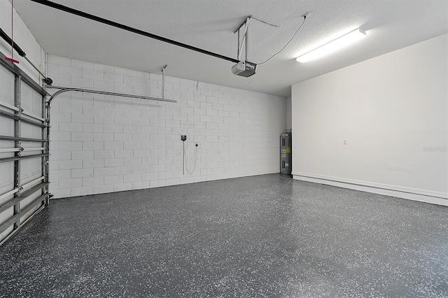 9049 Edenshire Cir, Orlando, FL 32836 - garage featuring a garage door opener, electric water heater, and concrete block wall