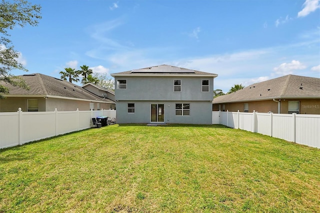 9049 Edenshire Cir, Orlando, FL 32836 - rear view of property featuring solar panels, a fenced backyard, and stucco siding