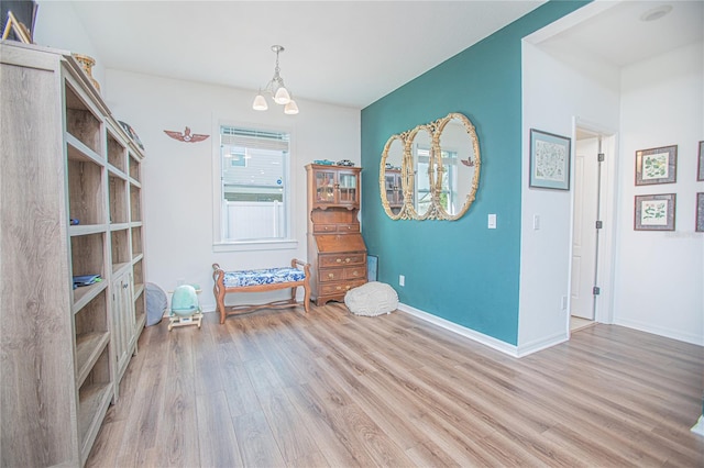 786 Steerview St, Saint Cloud, FL 34771 - spare room with wood finished floors and a chandelier