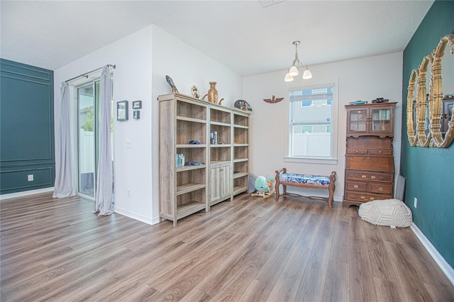 786 Steerview St, Saint Cloud, FL 34771 - dining space featuring wood finished floors and a chandelier