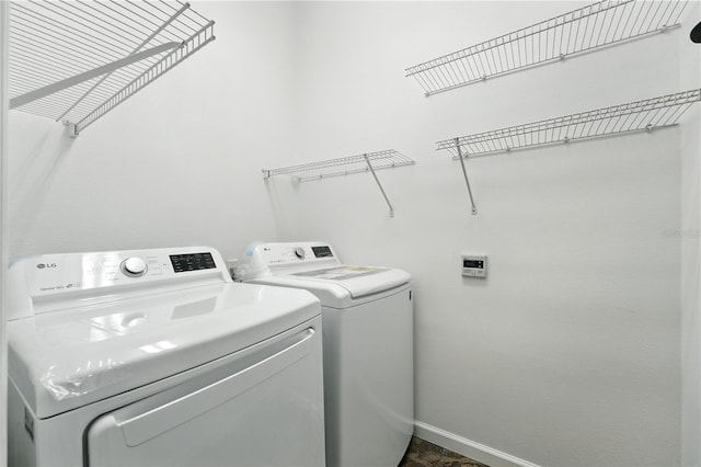 15350 Arabian Way, Montverde, FL 34756 - laundry room featuring washing machine and dryer and baseboards