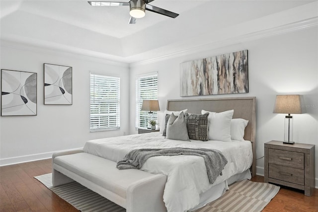 15350 Arabian Way, Montverde, FL 34756 - bedroom featuring wood finished floors, a tray ceiling, ornamental molding, and a ceiling fan