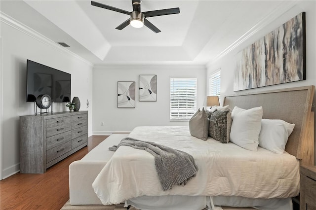 15350 Arabian Way, Montverde, FL 34756 - bedroom with a raised ceiling, wood finished floors, ceiling fan, and ornamental molding