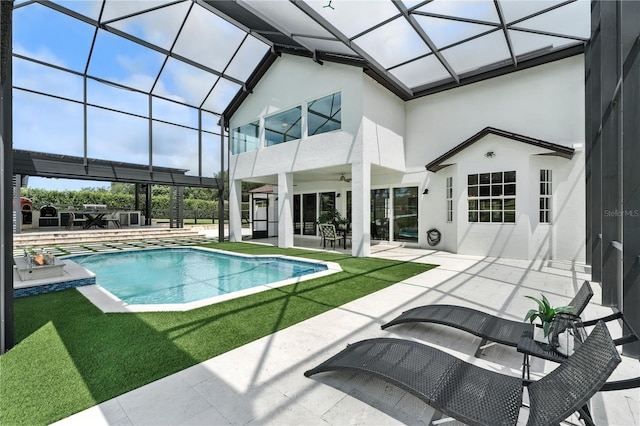 15350 Arabian Way, Montverde, FL 34756 - swimming pool featuring a ceiling fan, a patio area, and glass enclosure