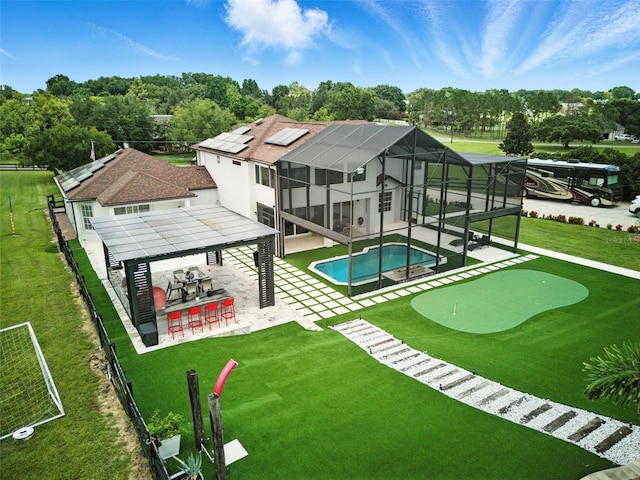 15350 Arabian Way, Montverde, FL 34756 - back of house featuring a patio, a putting area, a gazebo, an outdoor pool, and a lawn