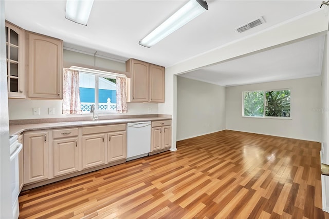 877 Great Bend Rd, Altamonte Springs, FL 32714 - kitchen with white dishwasher, light wood-style floors, light countertops, ornamental molding, and glass insert cabinets