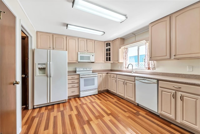 877 Great Bend Rd, Altamonte Springs, FL 32714 - kitchen featuring white appliances, light wood finished floors, cream cabinetry, and glass insert cabinets