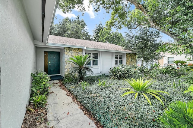 877 Great Bend Rd, Altamonte Springs, FL 32714 - entrance to property featuring stone siding and roof with shingles