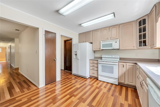 877 Great Bend Rd, Altamonte Springs, FL 32714 - kitchen with white appliances, light wood finished floors, light countertops, glass insert cabinets, and crown molding