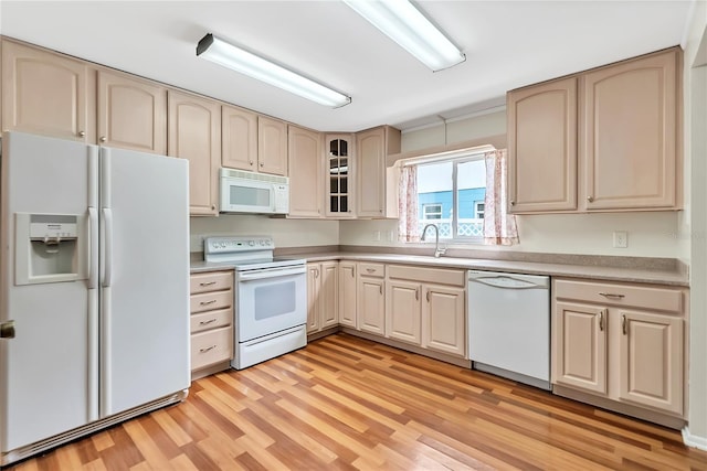 877 Great Bend Rd, Altamonte Springs, FL 32714 - kitchen featuring white appliances, light wood-style floors, glass insert cabinets, light countertops, and cream cabinetry