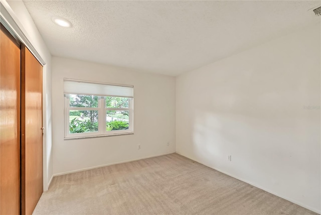 877 Great Bend Rd, Altamonte Springs, FL 32714 - unfurnished bedroom with a closet, light carpet, a textured ceiling, and recessed lighting