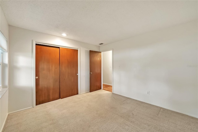 877 Great Bend Rd, Altamonte Springs, FL 32714 - unfurnished bedroom featuring carpet floors, a closet, recessed lighting, and a textured ceiling