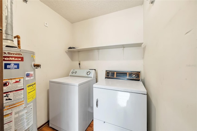 877 Great Bend Rd, Altamonte Springs, FL 32714 - laundry room featuring gas water heater, washing machine and clothes dryer, a textured ceiling, and light wood-type flooring