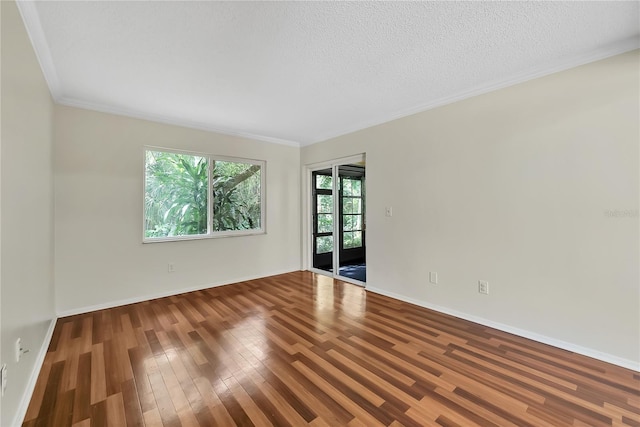 877 Great Bend Rd, Altamonte Springs, FL 32714 - spare room with wood finished floors, crown molding, and a textured ceiling