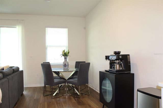 4426 Small Creek Rd, Kissimmee, FL 34744 - dining area with dark wood-style flooring and baseboards