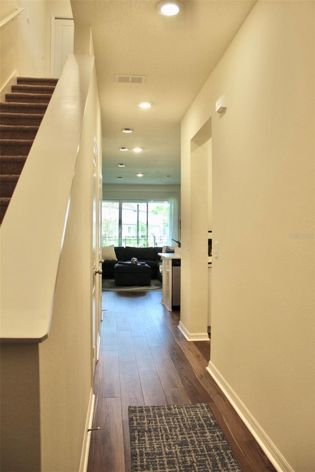 4426 Small Creek Rd, Kissimmee, FL 34744 - hall with dark wood-style floors, stairs, and recessed lighting