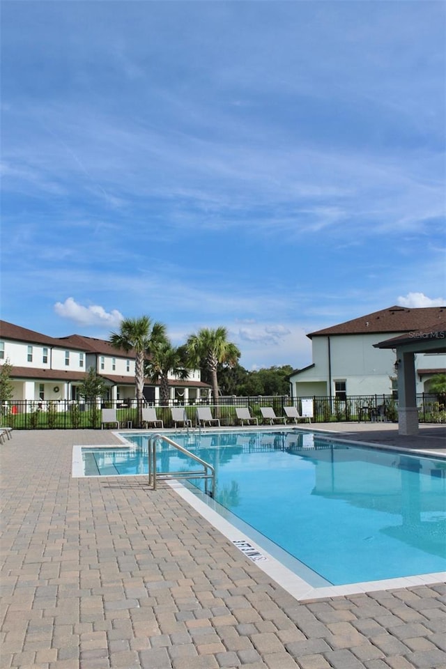 4426 Small Creek Rd, Kissimmee, FL 34744 - community pool featuring a patio area